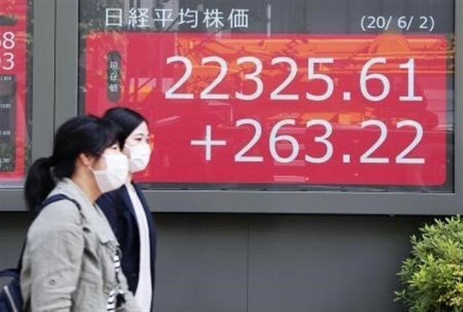 Thị trường chứng khoán châu Á tăng điểm trong phiên 12/1 ảnh 1