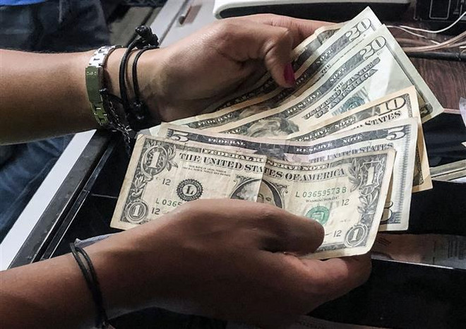 Đồng USD lên giá mạnh so với các đồng tiền chủ chốt phiên 23/3 ảnh 1