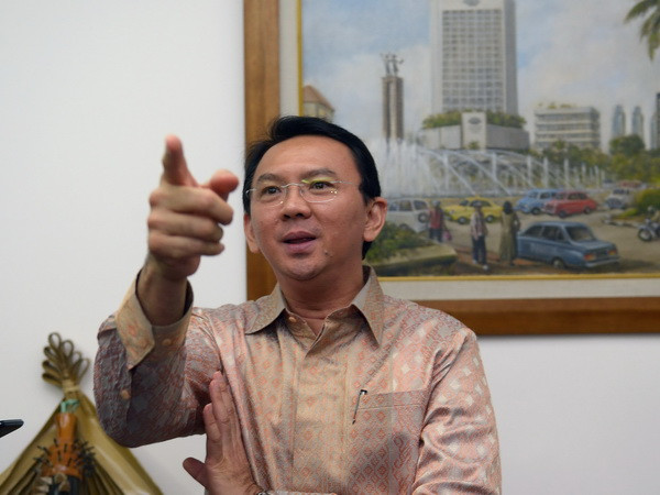 Thị trưởng thành phố Jakarta Basuki Tjahaja Purnama phát biểu trước báo giới tại thành phố Jakarta ngày 14/8/2014. (Ảnh: AFP/TTXVN) Thị trưởng Jakarta sẽ phải hầu tòa vì cáo buộc phỉ báng đạo Hồi ảnh 1