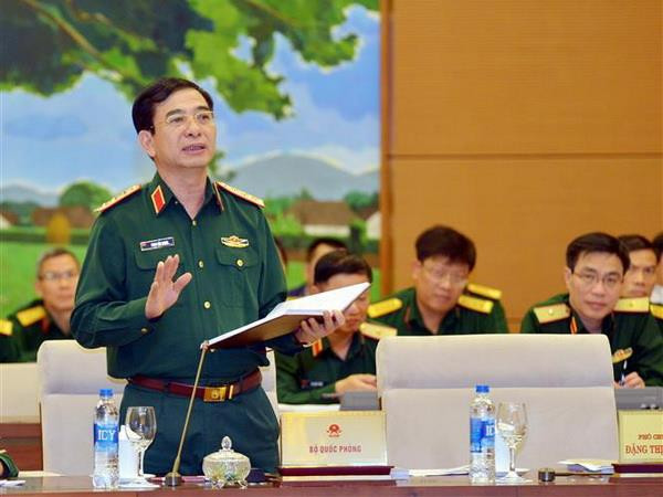 Thượng tướng Phan Văn Giang, Tổng Tham mưu trưởng, Thứ trưởng Bộ Quốc phòng trình bày tờ trình. (Ảnh: Trọng Đức/TTXVN) Xây dựng lực lượng dự bị động viên hùng hậu, chất lượng cao ảnh 1