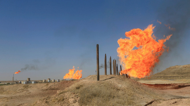 Một mỏ dầu tại Kirkuk, Iraq. (Nguồn: Reuters) Nga thắng Mỹ trong ''ván cờ dầu khí'' ở Trung Đông? ảnh 1