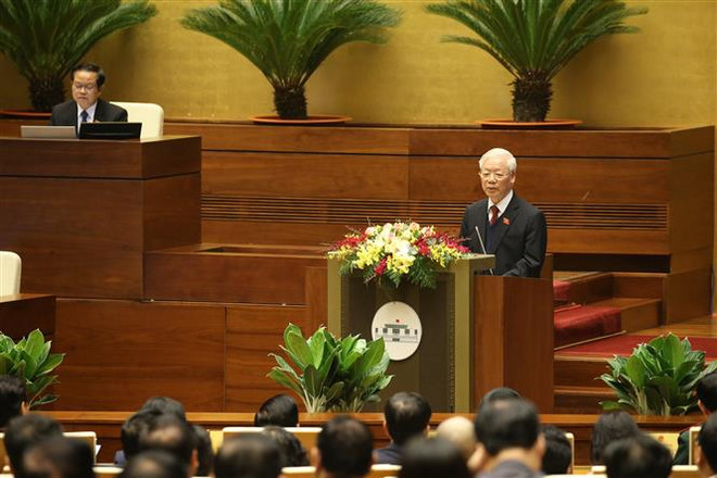 Tổng Bí thư, Chủ tịch nước Nguyễn Phú Trọng trình bày Báo cáo tổng kết công tác nhiệm kỳ 2016-2021 của Chủ tịch nước. (Ảnh: Dương Giang/TTXVN) Báo cáo tóm tắt tổng kết công tác nhiệm kỳ 2016-2021 của Chủ tịch nước ảnh 3