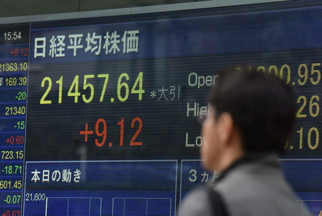 Chỉ số chứng khoán Tokyo tăng lên mức kỷ lục trong 21 năm qua ảnh 1