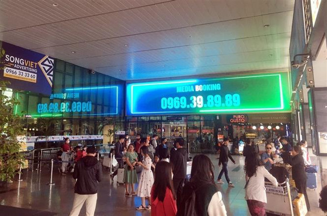 Sân bay Tân Sơn Nhất có gần 920 chuyến bay trong ngày mùng 8 Tết ảnh 1