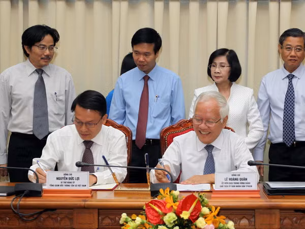 Thành phố Hồ Chí Minh và TTXVN đẩy mạnh hợp tác thông tin ảnh 1