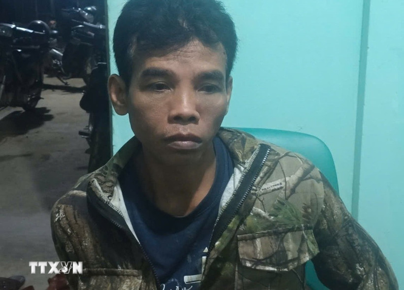 Đối tượng Điểu Trung bị bắt. (Ảnh: TTXVN phát)