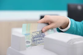 Lợi nhuận ngành ngân hàng tăng trưởng ấn tượng, ABBANK và KienlongBank gây chú ý. (Ảnh: Vietnam+)