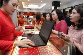 Giá vàng trong nước đã tăng lên mức 154 triệu đồng mỗi lượng. (Ảnh: Vietnam+)