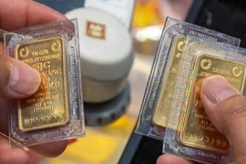 Giá vàng SJC của Công ty vàng bạc đá quý Sài Gòn và Công ty Doji niêm yết từ 152,2-154,2 triệu đồng/lượng. (Ảnh: VIetnam+)