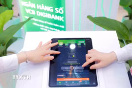 Ngành Ngân hàng đặt an toàn số làm nền tảng cho chuyển đổi số và ứng dụng. (Nguồn: TTXVN)