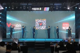 Lễ công bố kết nối thanh toán bán lẻ song phương qua mã QR giữa Việt Nam và Trung Quốc. (Ảnh: Vietnam+)