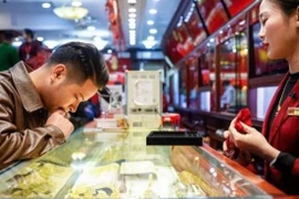 Giá vàng trong nước đi ngang, giao dịch quanh mức 156,4 triệu đồng. (Ảnh: Vietnam+)