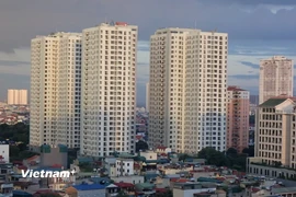 Năm 2026 Ngân hàng Nhà nước sẽ kiểm soát chặt thị trường bất động sản và hướng dòng vốn vào các dự án thực. (Ảnh: Vietnam+)