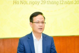 Ông Phạm Chí Quang, Vụ trưởng Vụ Chính sách tiền tệ Ngân hàng Nhà nước chia sẻ tại họp báo. (Ảnh: Vietnam+)