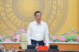 Phó Thống đốc Ngân hàng Nhà nước Phạm Quang Dũng phát biểu tại cuộc họp. (Ảnh: Vietnam+)