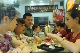 Giá vàng trong nước hạ nhiệt, giao dịch ở mức 119 triệu đồng mỗi lượng. (Ảnh: Vietnam+)