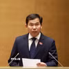 Ủy viên Ủy ban Thường vụ Quốc hội, Tổng Thư ký Quốc hội - Chủ nhiệm Văn phòng Quốc hội Lê Quang Mạnh trình bày dự thảo Nghị quyết Kỳ họp thứ nhất. (Ảnh: Tuấn Anh/TTXVN)