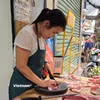 Người dân cần được trang bị kiến thức và phát huy vai trò giám sát, tố giác vi phạm. (Ảnh: Vietnam+)