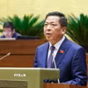 Bộ trưởng Bộ Xây dựng Trần Hồng Minh phát biểu giải trình, làm rõ một số vấn đề đại biểu Quốc hội nêu. (Ảnh: Doãn Tấn/TTXVN)