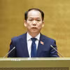 Bộ trưởng Tư pháp Hoàng Thanh Tùng, thừa ủy quyền của Thủ tướng Chính phủ trình bày Tờ trình về 4 dự án Luật sửa đổi, bổ sung một số điều của Luật Trợ giúp pháp lý. (Ảnh: Doãn Tấn - TTXVN)