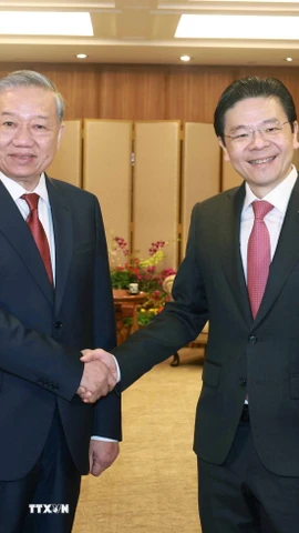 Thủ tướng Singapore, Tổng Thư ký Đảng Hành động nhân dân Singapore (PAP) Lawrence Wong đón Tổng Bí thư Tô Lâm. (Ảnh: Thống Nhất/TTXVN)