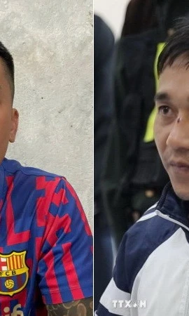 Đối tượng Phạm Anh Tài, còn gọi là Tài “đen” (trái) và Lê Văn Ân, sinh năm 1993 tại cơ quan công an. (Ảnh: TTXVN phát)