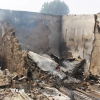 Hiện trường một vụ tấn công tại Auno, Nigeria. (Ảnh: AFP/TTXVN)