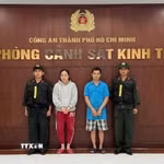 Hai 2 bị can là vợ chồng Nguyễn Thị Mỹ Phụng và Phạm Tuấn Thanh bị bắt tạm giam. (Ảnh: TTXVN phát)