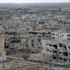 Những tòa nhà bị hư hại nặng nề do chiến sự tại Daraa, Syria. (Ảnh: THX/TTXVN)