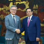 Thủ tướng Phạm Minh Chính tiếp Bộ trưởng Bộ Ngoại giao Lào Thongsavanh Phomvihane. (Ảnh: Dương Giang/TTXVN)