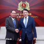 Đại tướng Lương Tam Quang, Bộ trưởng Bộ Công an Việt Nam với Thường trực Ban Bí thư Trung ương Đảng Nhân dân Cách mạng Lào Vilay Lakhamphong. (Ảnh: Phạm Kiên/TTXVN)
