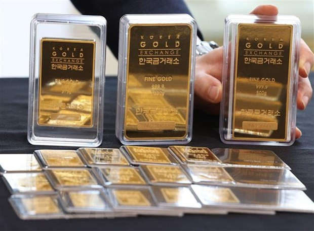 Ảnh minh họa (Nguồn: AFP/TTXVN) Phiên giao dịch 18/4 giá vàng thế giới tăng khi đồng USD yếu ảnh 1