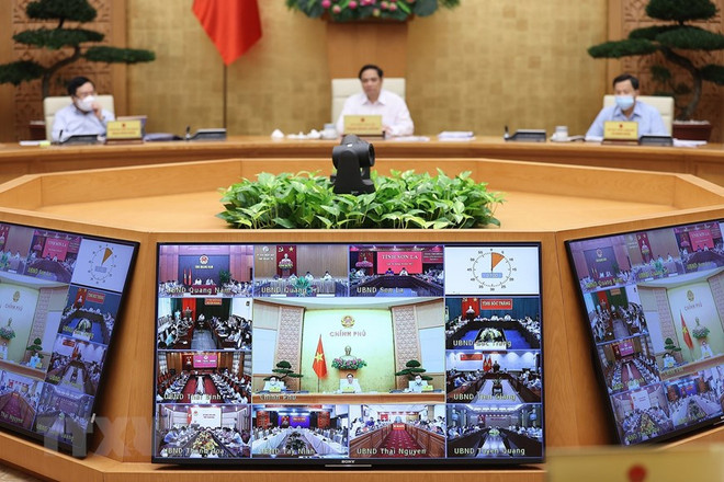 Các địa phương tham dự Phiên họp Chính phủ thường kỳ tháng 9 theo hình thức trực tuyến. (Ảnh: Dương Giang/TTXVN) Nghị quyết họp Chính phủ: Xây dựng lộ trình tiêm vaccine cho trẻ em ảnh 3