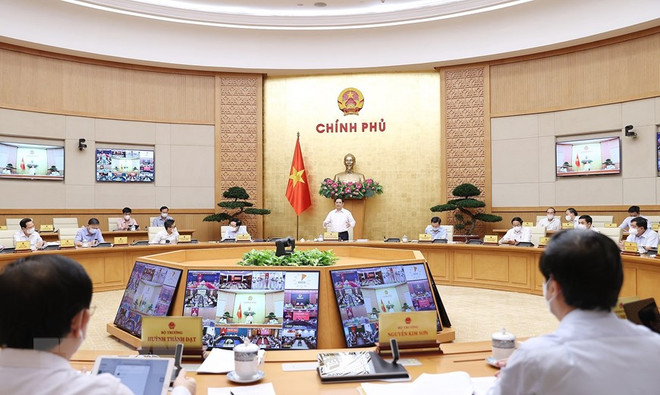 Thủ tướng Phạm Minh Chính chủ trì Phiên họp Chính phủ thường kỳ tháng 9. (Ảnh: Dương Giang/TTXVN) Nghị quyết họp Chính phủ: Xây dựng lộ trình tiêm vaccine cho trẻ em ảnh 1