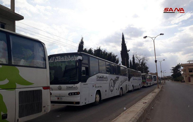 Phiến quân Syria rời khỏi Qalamoun. (Nguồn: SANA) Giao nộp xe tăng và tên lửa TOW, phiến quân Syria rút khỏi Qalamoun ảnh 1