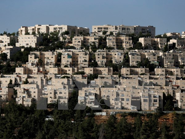 Khu định cư Do Thái Ramat Shlomo tại Jerusalem ngày 7/6. (Nguồn: AFP/TTXVN) HĐBA thông qua nghị quyết yêu cầu Israel ngừng hoạt động định cư ảnh 1