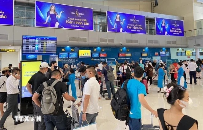Người lao động chuẩn bị về quê trong kỳ nghỉ lễ dài ngày. (Ảnh: TTXVN) z5550381726439_5e1ae2958457bad998e07f6d463eccdc.jpg