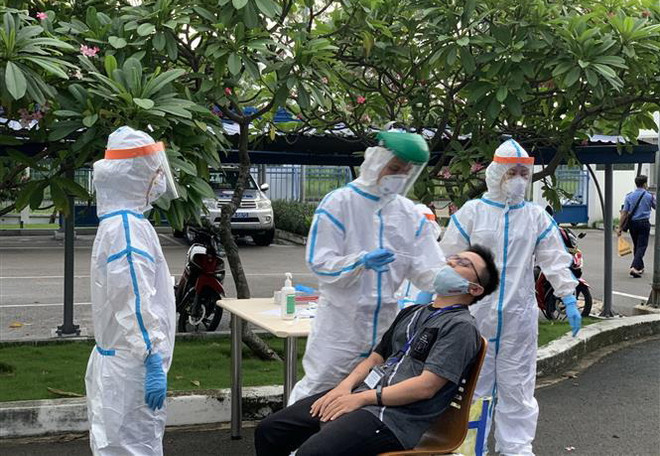 Thêm 11 trường hợp dương tính với SARS-CoV-2 ở Thành phố Hồ Chí Minh ảnh 1