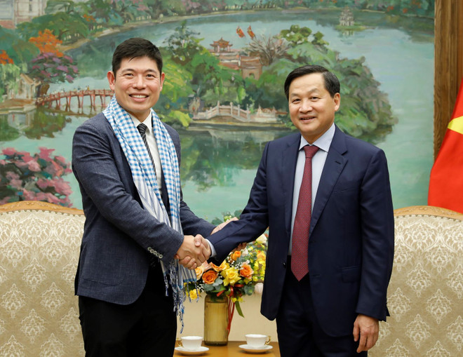 Phó Thủ tướng Lê Minh Khái đón Tổng Giám đốc kiêm đồng sáng lập Tập đoàn Grab toàn cầu Anthony Tan. (Ảnh: An Đăng/TTXVN) Phó Thủ tướng Lê Minh Khái: Grab cần lưu ý nguyên tắc chia sẻ lợi ích ảnh 1