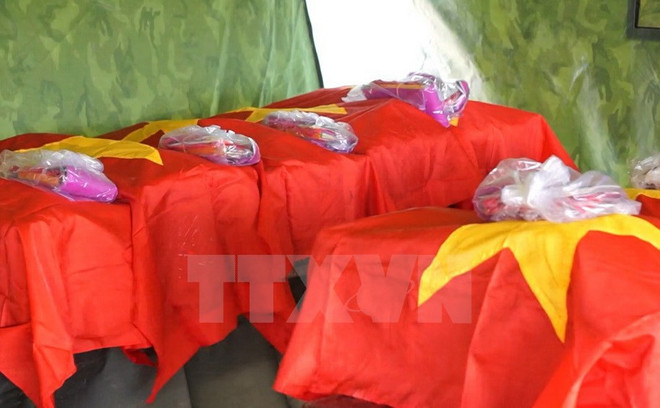 Truy điệu, an táng 9 hài cốt quân tình nguyện Việt Nam hy sinh tại Lào ảnh 1