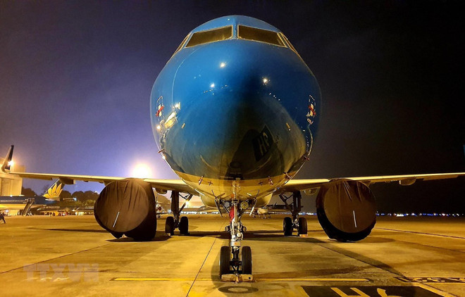 Máy bay của Vietnam Airlines. (Ảnh: TTXVN) Máy bay của Vietnam Airlines đã đưa công dân Italy về nước ảnh 1