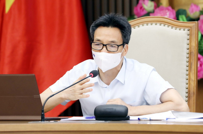 Phó Thủ tướng Chính phủ Vũ Đức Đam chủ trì cuộc họp trực tuyến với lãnh đạo tỉnh Bình Dương về việc triển khai các biện pháp cấp bách để khống chế dịch bệnh ở địa phương này. (Ảnh: Phạm Kiên/TTXVN) Phó Thủ tướng: Bình Dương khoanh gọn, không để dịch COVID-19 lan rộng ảnh 1
