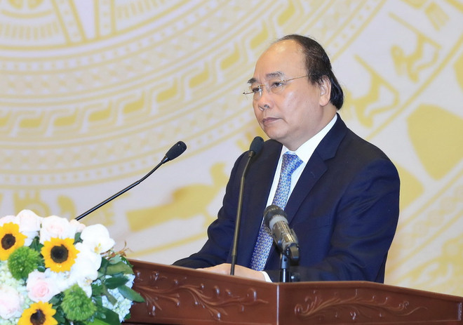 Thủ tướng Nguyễn Xuân Phúc phát biểu tại hội nghị. (Ảnh: Thống Nhất/TTXVN) Thủ tướng: Vẫn còn tình trạng "ngâm" hồ sơ đầu tư xây dựng ảnh 1