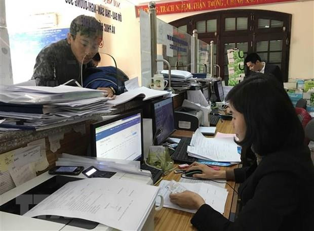 Ảnh minh họa. (Nguồn: TTXVN) Thủ tục hành chính: Còn khó cho cả doanh nghiệp và cơ quan giải quyết ảnh 1