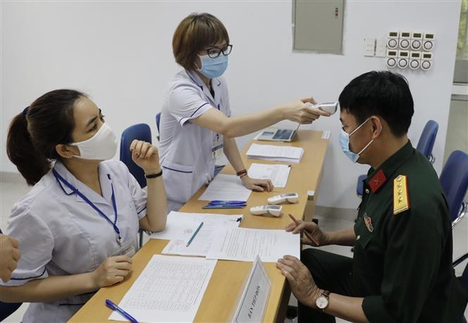 Bộ Y tế hướng dẫn khám sàng lọc trước khi tiêm vaccine COVID-19 ảnh 1