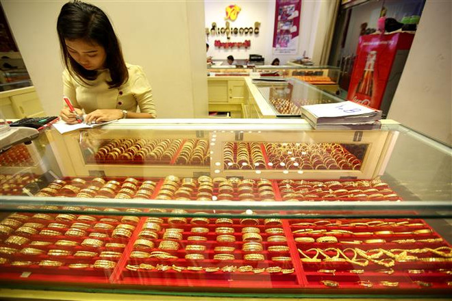 Giá vàng đi xuống tại châu Á trong phiên đầu tuần 14/12 ảnh 1