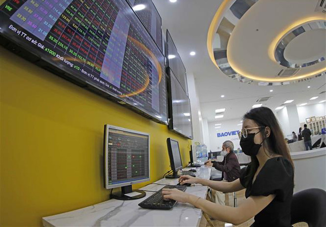 Thị trường chứng khoán thu hẹp đà tăng, VN-Index nhích hơn 2 điểm ảnh 1