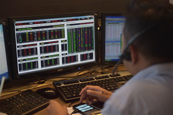 Tâm lý lạc quan của giới đầu tư giúp chứng khoán châu Á tăng điểm ảnh 1