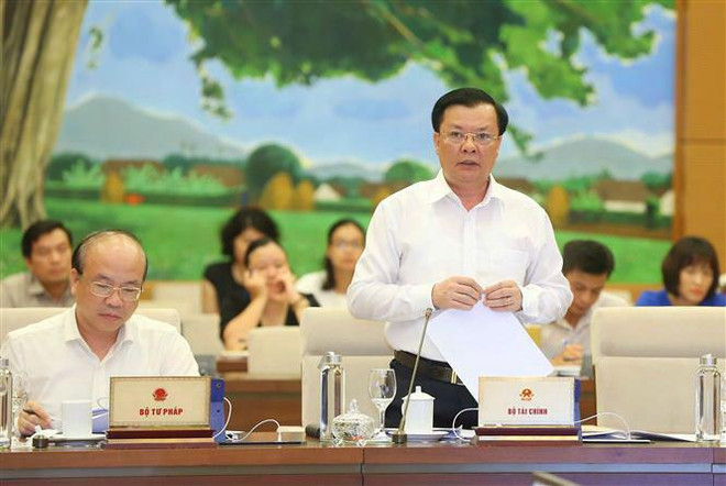 Bộ trưởng Bộ Tài chính Đinh Tiến Dũng phát biểu ý kiến. (Ảnh: Doãn Tấn/TTXVN) Thống nhất ý kiến Ủy ban Chứng khoán Nhà nước trực thuộc Bộ Tài chính ảnh 2