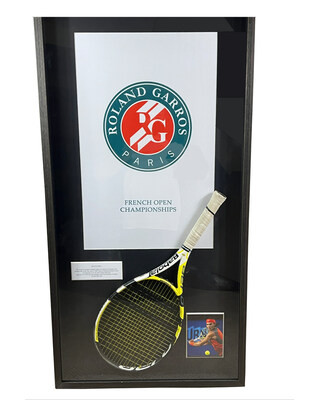 Rafael Nadal's championship point winning racket from his 2007 French Open Final victory over Roger Federer, in custom framing. The racket comes with a Resolution Photomatch document, forensically confirming it was the very racket which won the final point. Rafael Nadal's championship point winning racket from his 2007 French Open Final victory over Roger Federer, in custom framing. The racket comes with a Resolution Photomatch document, forensically confirming it was the very racket which won the final point.